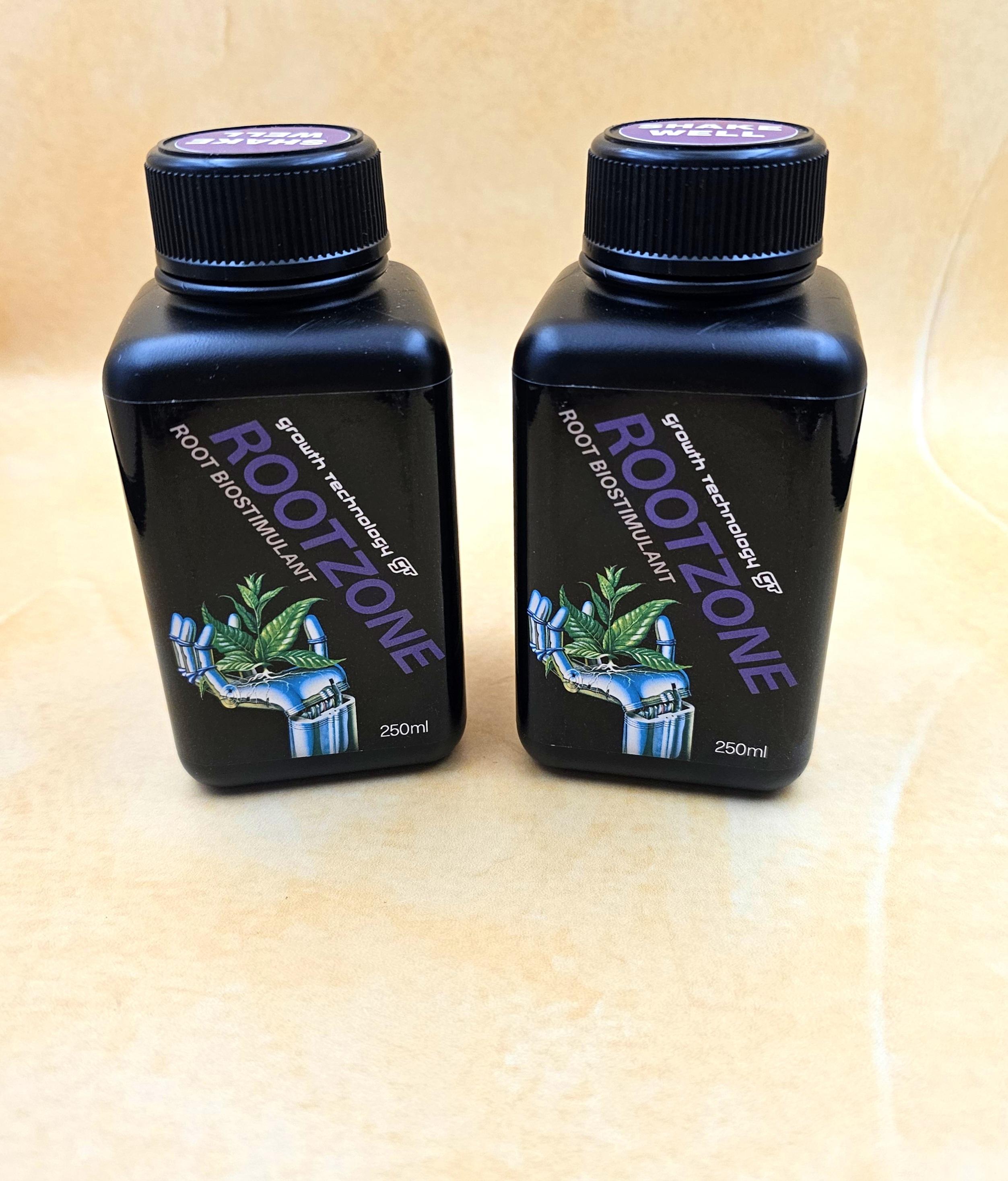 Two bottles of Rootzone root stimulant on a beige surface